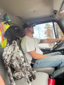 adam smith and dog in knuckles, the alabama debris truck